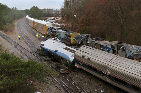 An aerial view shows the aftermath of an early morning <strong>train crash</strong> on Sunday between an Amtrak <strong>train</strong>, bottom right, and a CSX goods <strong>train</strong>, top left, in Cayce, <strong>South Carolina</strong>. . South carolina train derailment